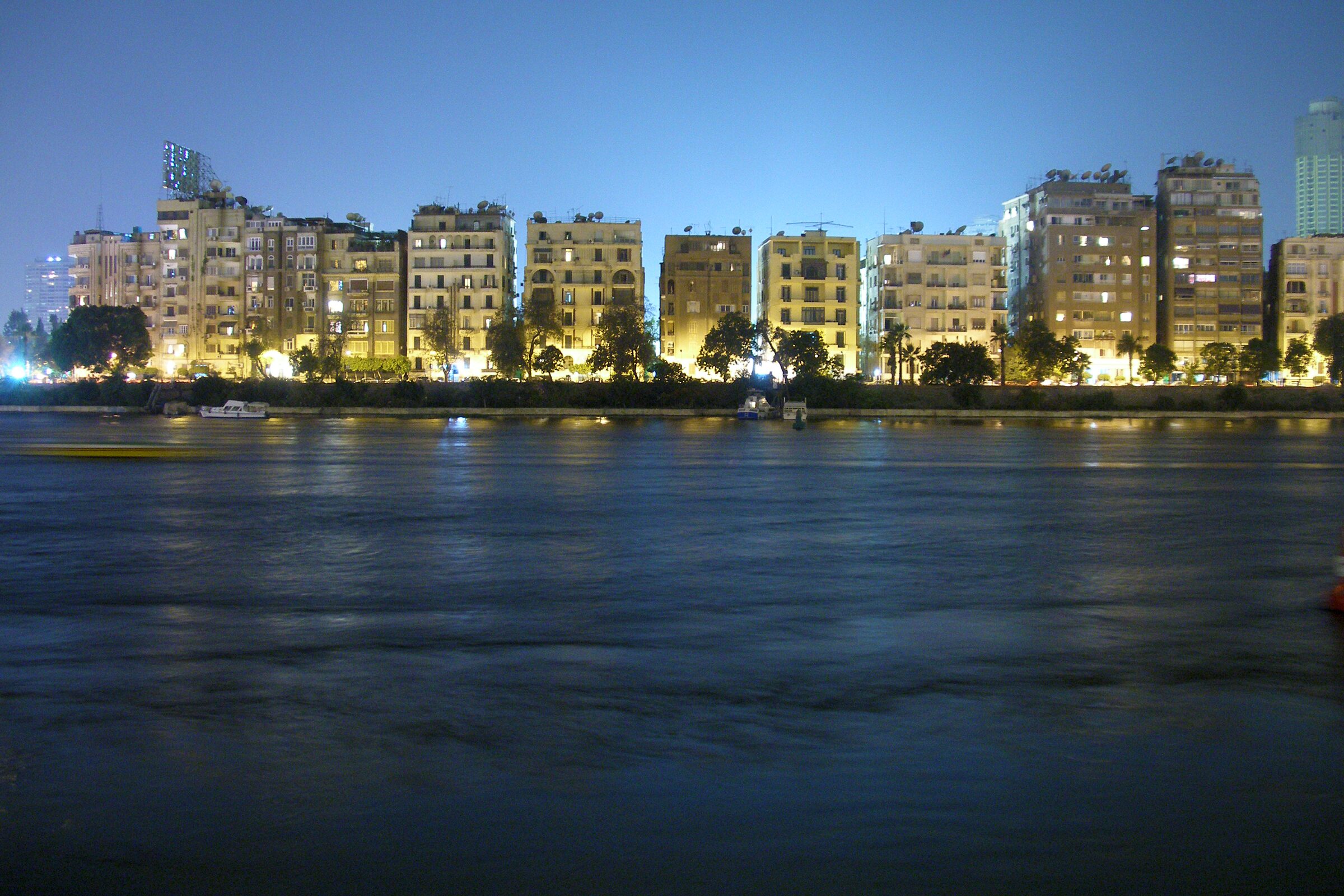 The Nile at night with Zamalek's lights on the far bank