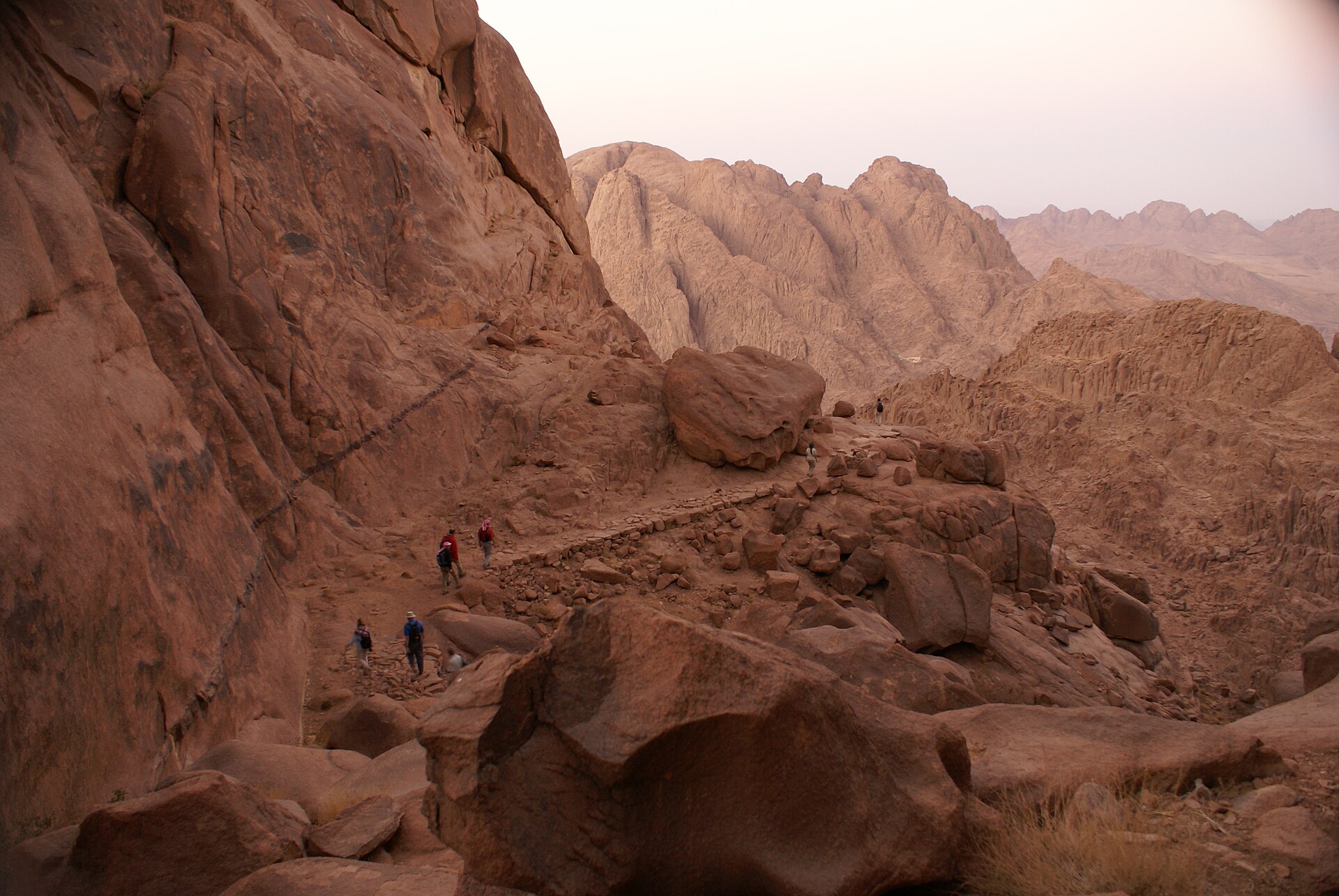 Hikers descending Mount Sinai toward Saint Catherine's Monastery