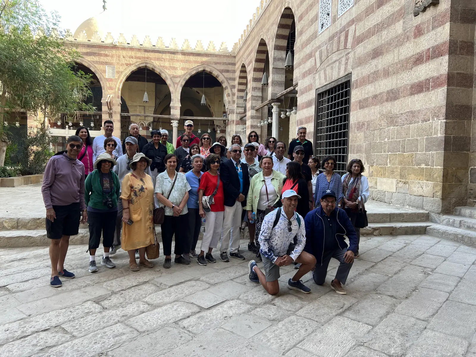 Atenara guests in a historic Cairo courtyard