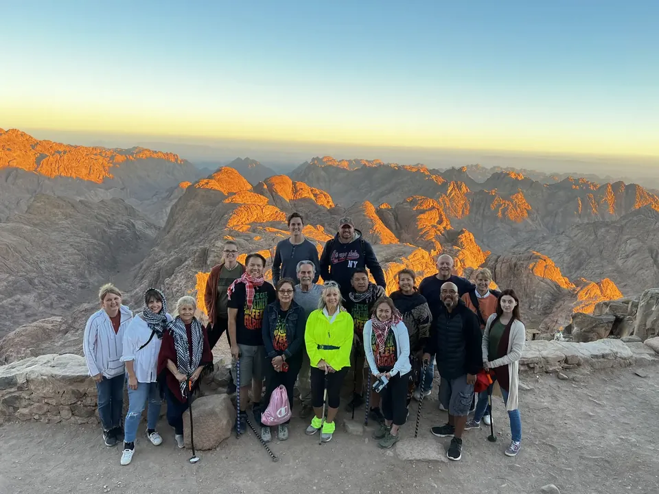 Atenara guests watching sunrise over the mountains of Sinai